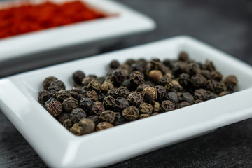 Black pepper. Colorful spices in white bowls Seasonings for cooking. Natural Herbs & Spices.