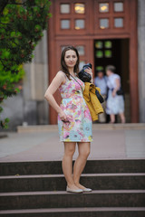 pretty young woman having fun in the city with camera travel photo of photographer