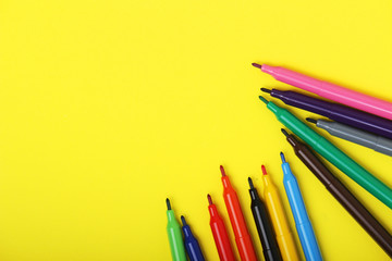 Multicolored markers at bright background	