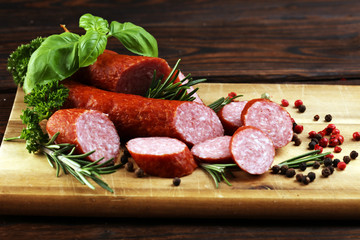 sausage slices, smoked meat product (tasty snack salami) menu concept. food background with cracow sausages