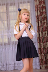 Cute cosplay little asian girl in school uniform