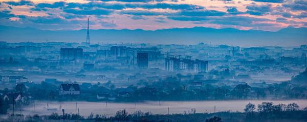 Panorama of the evening Ukrainian city in the haze