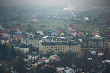 Houses in a city hazy in the autumn