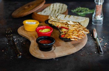 Grilled chicken fillet with boiled fresh vegetables .