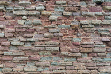 Red brick wall of an ancient fortress background