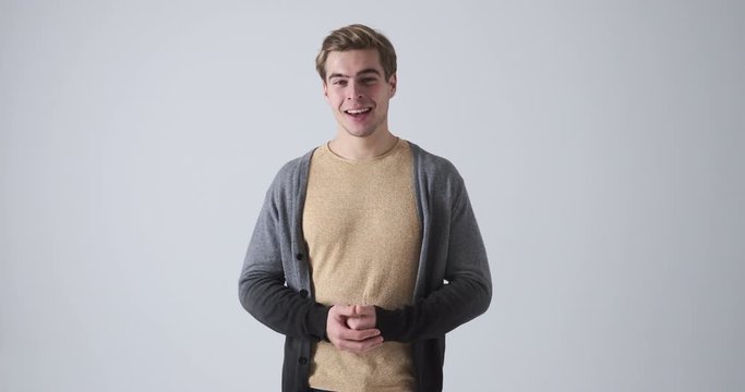 Handsome man vlogger speaking over white background