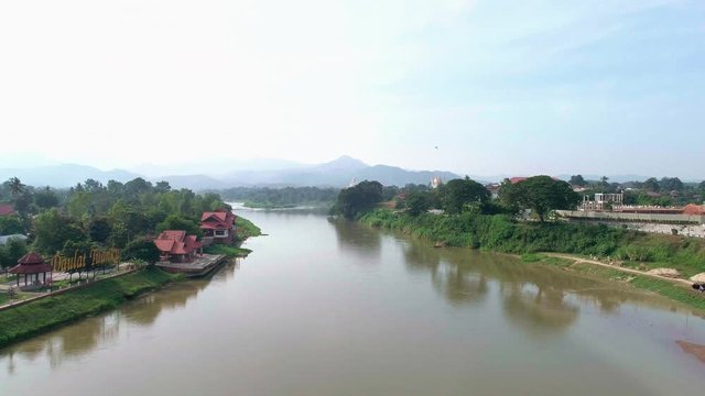 Aerial 4k footage of Sungai Perak and a bridge accross it in one of the city in Northern Malaysia, Kuala Kangsar in Perak, Malaysia. 