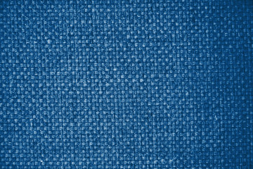 Classic blue color canvas texture natural background. Trendy color 2020. Art rough stylized texture banner. Space for text. Fabric canvas texture trend color classic blue .