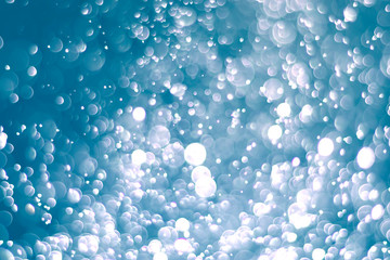 Abstract bokeh lights with light Blue background, beautiful bokeh from water droplets