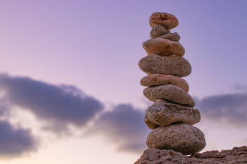 Fototapeta na wymiar Object of stones on the background of the night sky and the moon. Zen stones. Harmony & Meditation