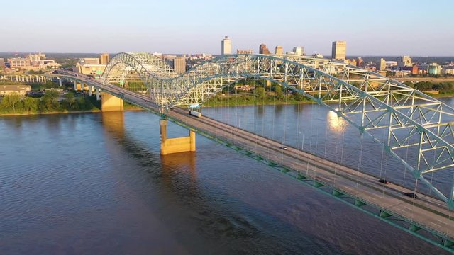 Excellent rising aerial over the Hernando de Soto Bridge reveals the city skyline and business district of Memphis, Tennessee.