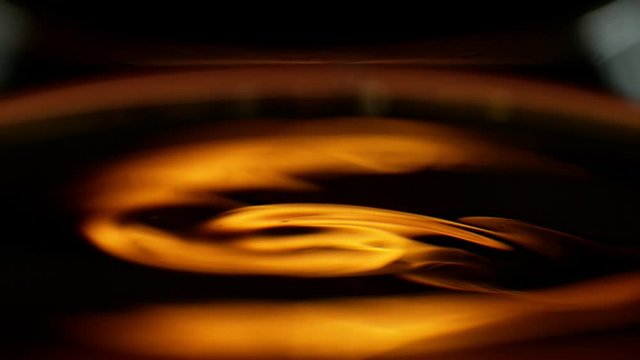 Super slow motion of waving whiskey, cognac or rum in macro shot. Filmed on high speed cinema camera, 1000 fps