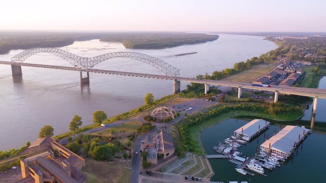 Good aerial over a barge on the Mississippi River with Hernando de Soto Bridge foreground.