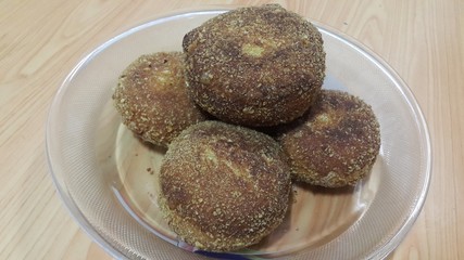 Closeup perspective view of fried pizza bombs or balls are altered form of pizza
