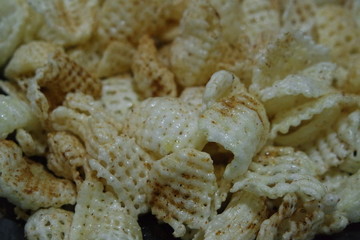 Closeup view of freshly fried chips as fast food usually eaten with tea.