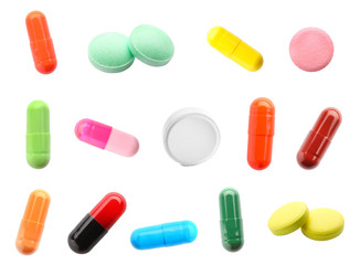 Different pills on white background