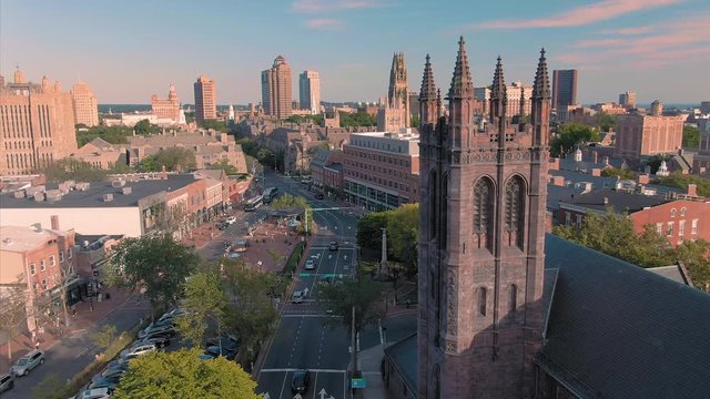 Aerial: Establishing shot of broadway street & church near Yale University t. New Haven, Connecticut, US