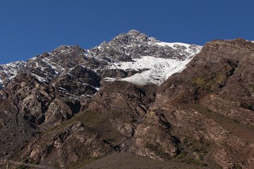 Beautiful mountain landscape in Cajón del Maipo, Chile. Snowy mountain and valley in Chilean central Andes