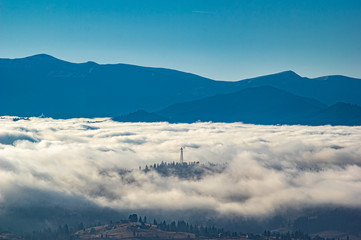 Carpathian mountains in the waves of fog