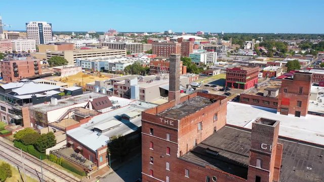 Aerial over mixed use industrial district of Memphis Tennessee with apartments, condos and converted old warehouses.