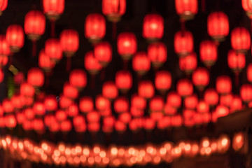 Chinese New Year red lantern background fuzzy landscape © bqmeng