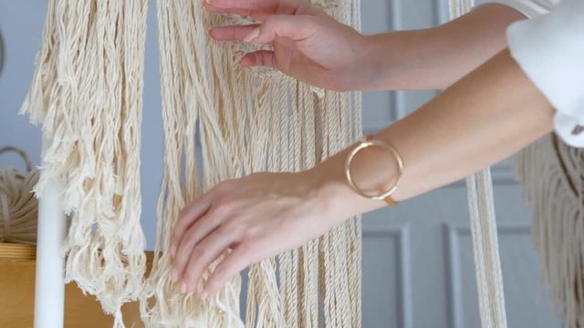 close-up sensual female hands spread macrame