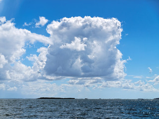 Rare Square shaped white cloud in blue sky. Australia.