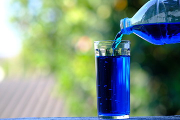 pouring water into glass