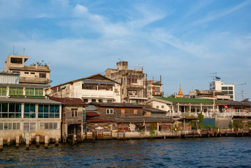 Fototapeta na wymiar Buildings on bank of Chao Phraya River in Bangkok, Thailand