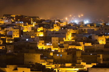 Night view of the Tetouan Medina quarter in Northern Morocco. A medina is typically walled, with many narrow and maze-like streets.