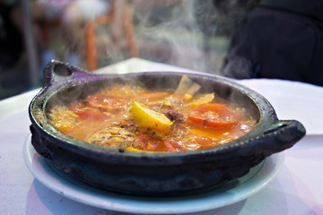 Tajine with stewed vegetables and fish. One of the types of Moroccan national cuisine.