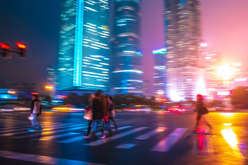 Abstract background of People across the crosswalk at night in Shanghai, China. - 307979318