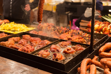 Selling traditional hot food at the Christmas Fair in evening.