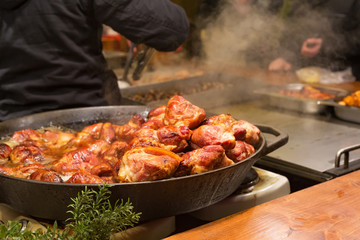 Selling traditional hot food at the Christmas Fair in evening.