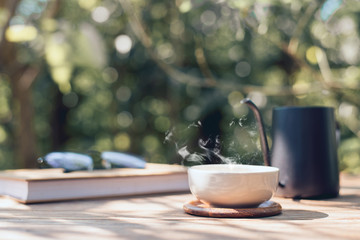 Garden reading table, Teacup placed on wooden table, Close-up