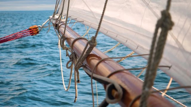 SLOW MOTION Boom of a Main Sail above the Water