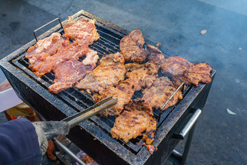 Delicious grilled pork chop on barbecue charcoal pan 
