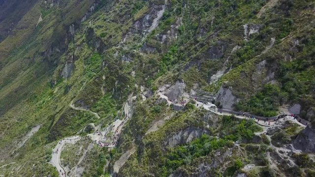 Aerial shot stairs staircase down to Quilotoa, Ecuador caldera in the Andes Mountains.