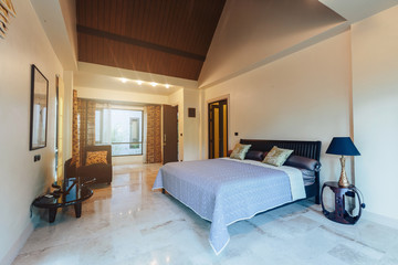 Modern bed room interior in Luxury villa. Big window, light space, marble floor