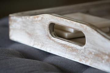 Ottoman furniture serving tray old rustic farmhouse handle close up.