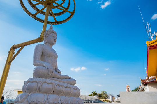 White buddha in Wat Sangkat Rattana Khiri on Khao Sakae Krang mountain in Uthai Thani, Thailand.