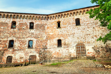 Fototapeta na wymiar The fortress wall in the old city of Vyborg on a bright sunny day. Close-up.