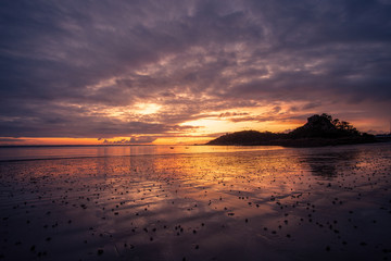 Purple sunset by a beach