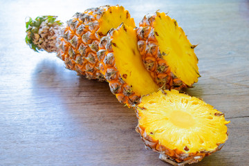 Sliced pineapples on the wooden table
