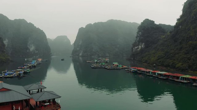 The traditional Cua Van Floating Village in Halong Bay, Vietnam