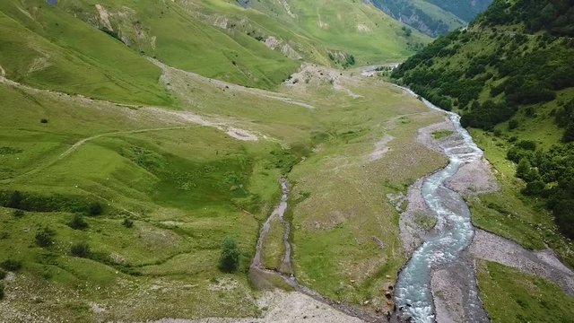 2019 - aerial of a river through the countryside in the Republic of Georgia.