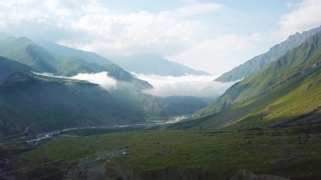 2019 - aerial of a river through the countryside in the Republic of Georgia.