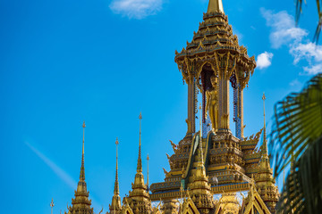 Fototapeta premium Uthai Thani, Thailand - November, 30, 2019 : Golden pagoda against blue sky at Wat Tha Sung in Uthai Thani, Thailand.