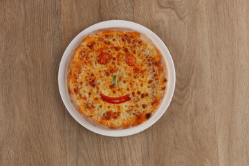 Margherita pizza with vegetables on a wooden background -  kids meal pizza