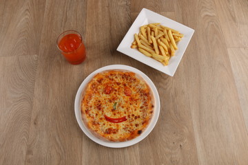 kids meal pizza - Margherita pizza with vegetables on a wooden background - basil - olives - for kids